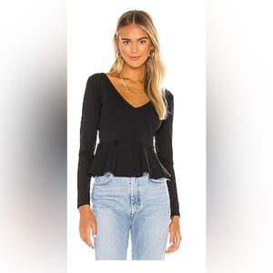 Susana Monaco Long Sleeve Peplum Blouse in Black
Color:Black size small